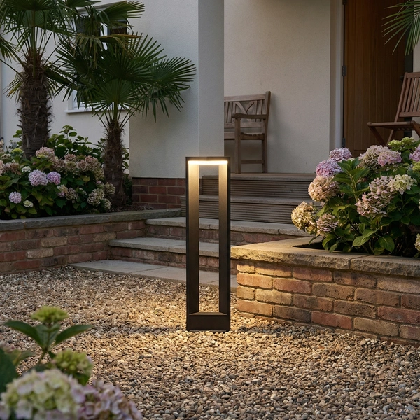 Sand Gray CORN-H bollard lighting a villa courtyard