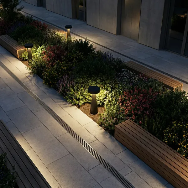 MUSH-F downward path light lining a greenery border at dusk