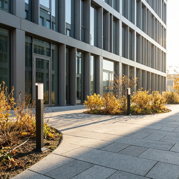 Black OBEL-A acrylic crown column beside a plaza walkway