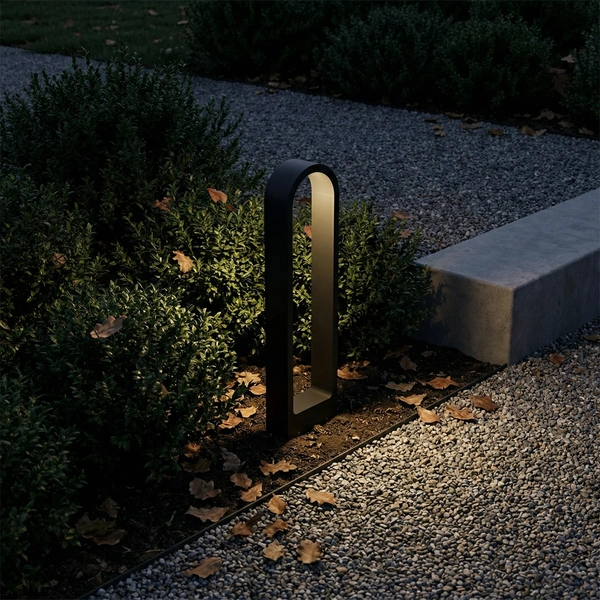 Row of PORT arch silhouette garden bollards edging a lawn walk