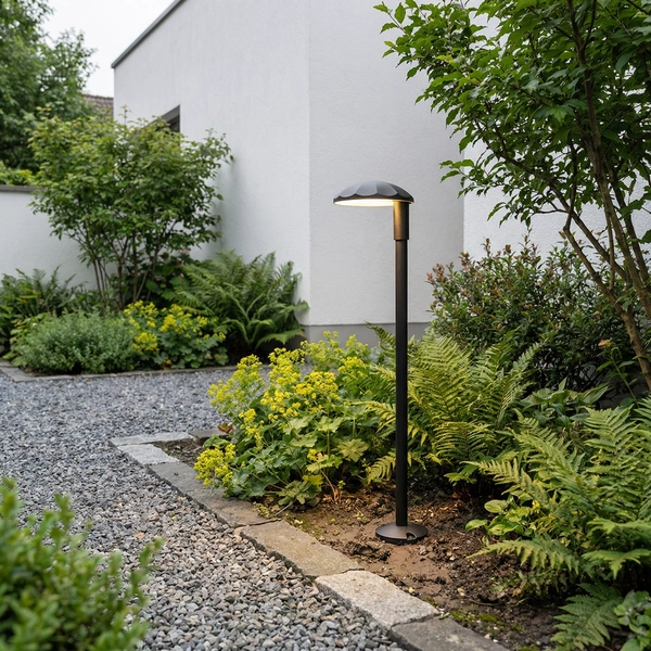 Gray SLIM-SR geometric column bollard lining walkway at dusk