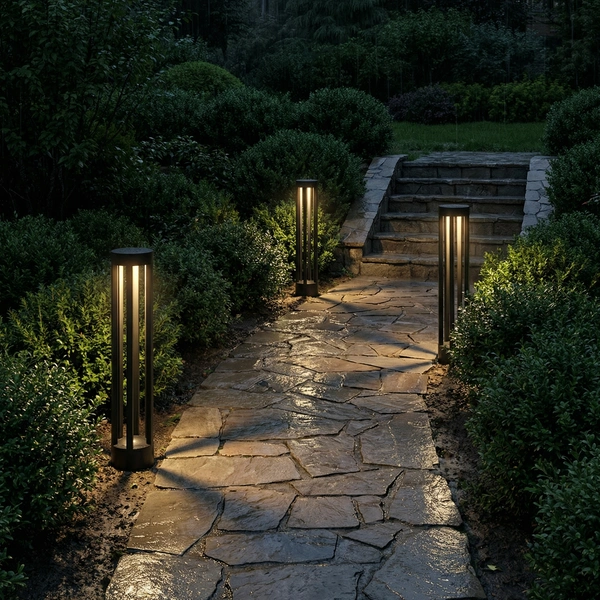 Grey VOID bollard washing a poolside deck at dusk